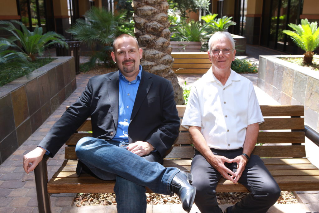 healthier 4u vending founders brian swain and del swain sitting outside headquarters